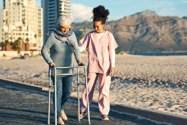 helping elderly patient walk
